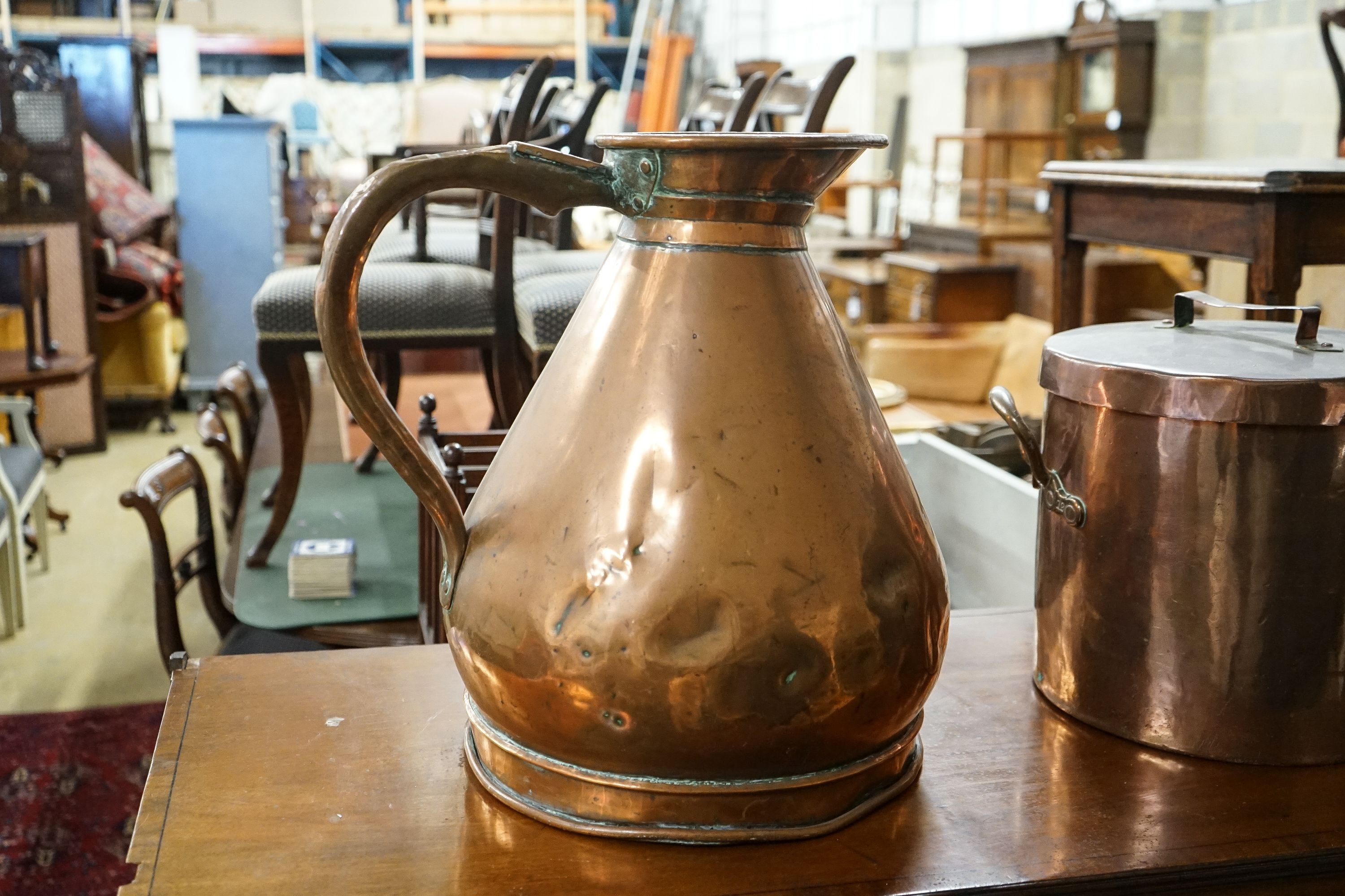 A Victorian copper jug measure, together with a Victorian copper harvest flagon, larger 48cm high